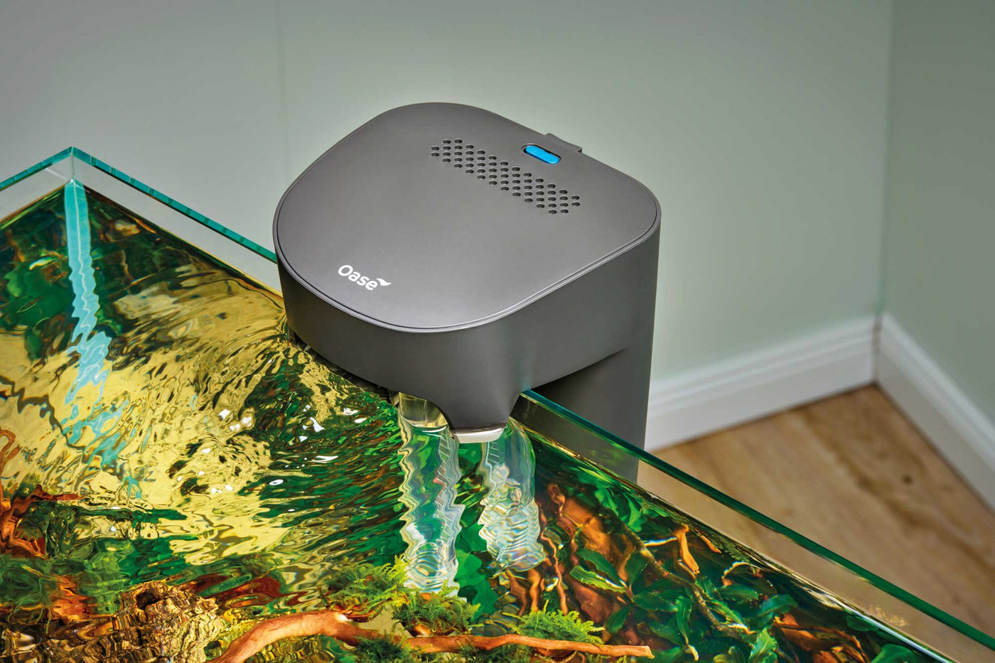 BioStyle power filter being used on a fish tank with water flowing out.