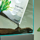 OASE black soil pouring into aquarium 